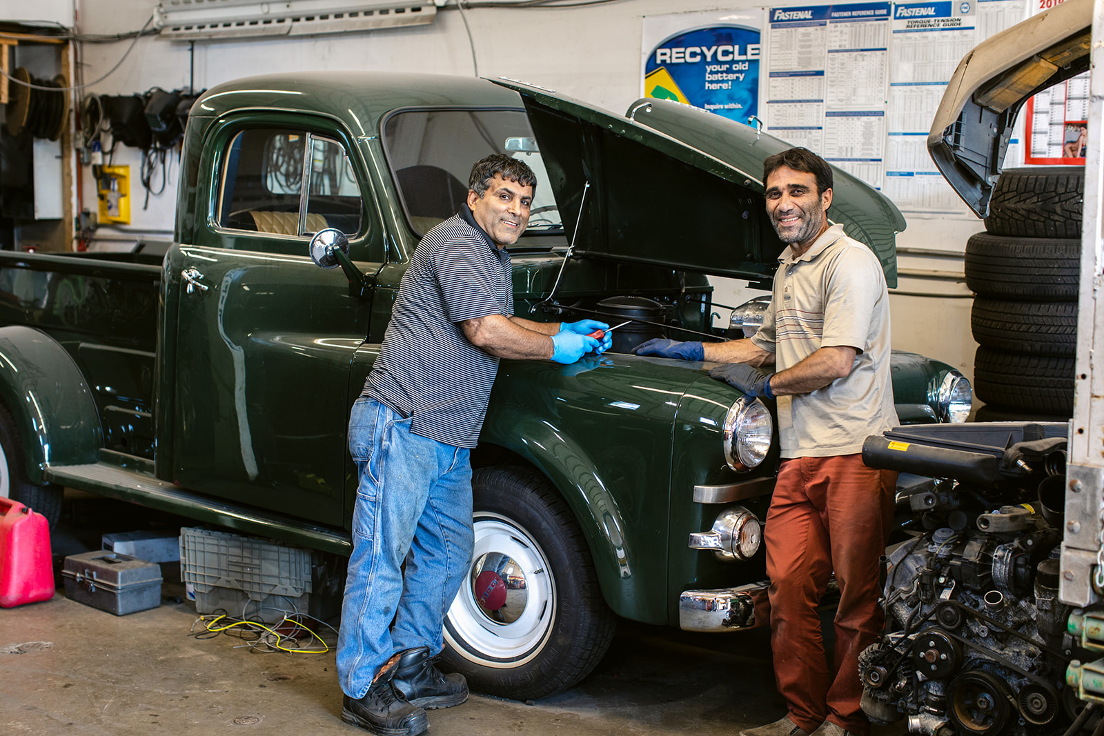 two automotive service technicians