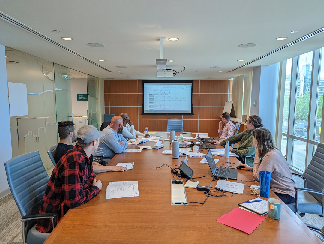 Participants sitting around table in workshop setting