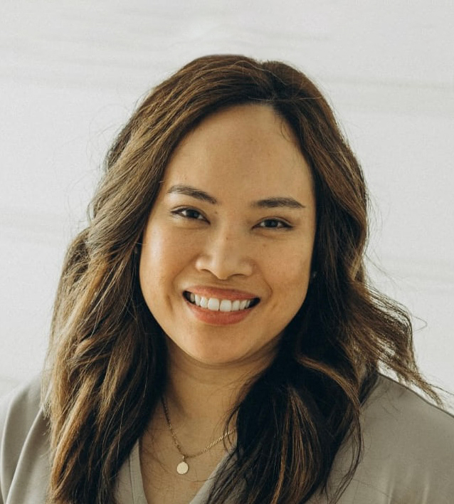 woman with brown eyes and light brown wavy hair