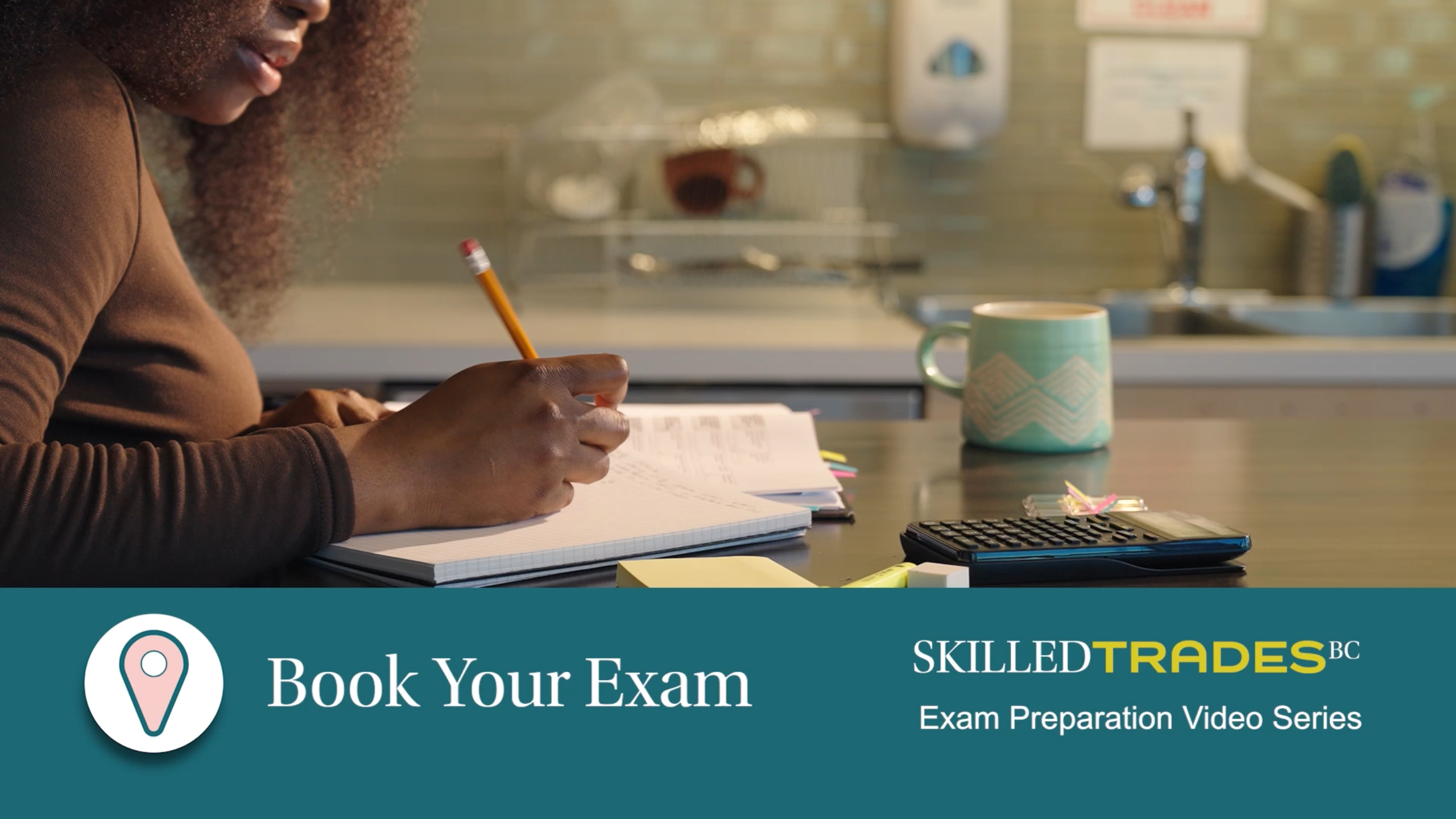 woman writing on paper on table