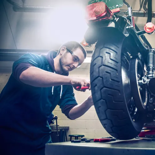 Motorcycle Mechanic with bike