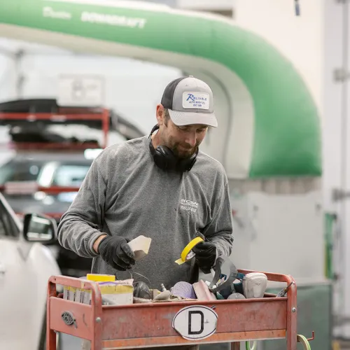 man working in car shop