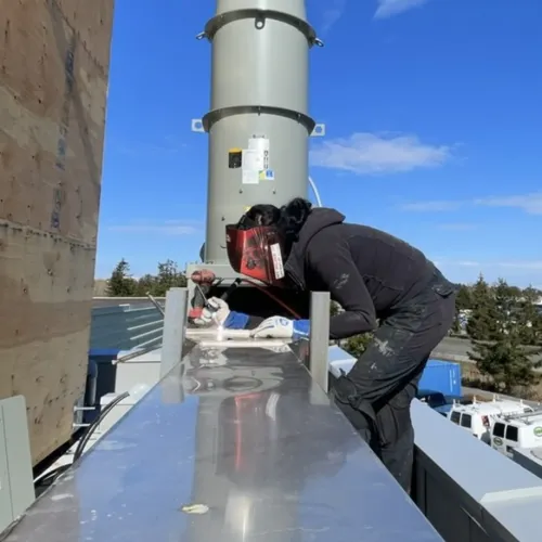 welder on roof